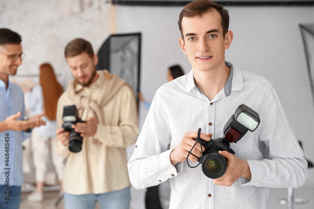 Male photographer during classes in studio