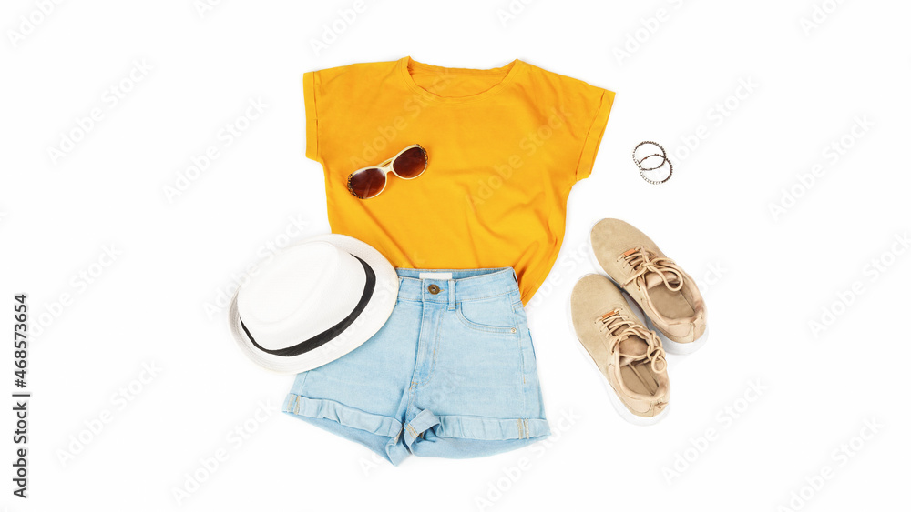 Womens summer clothes and accessories: orange t-shirt, denim shorts, sneakers, lipstick isolated on