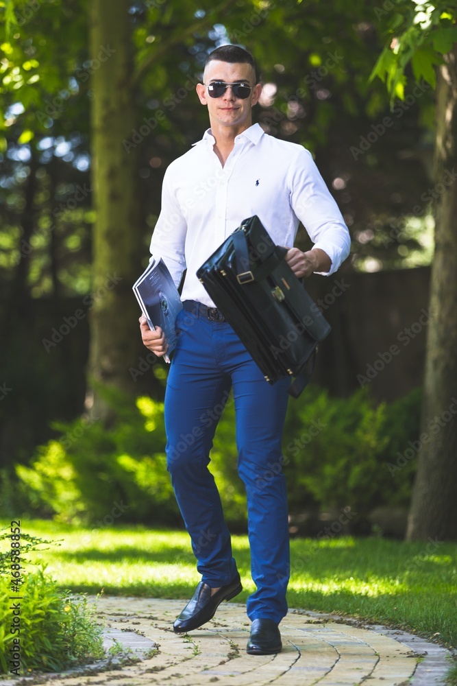 Portrait of happy mature man on outdoor background