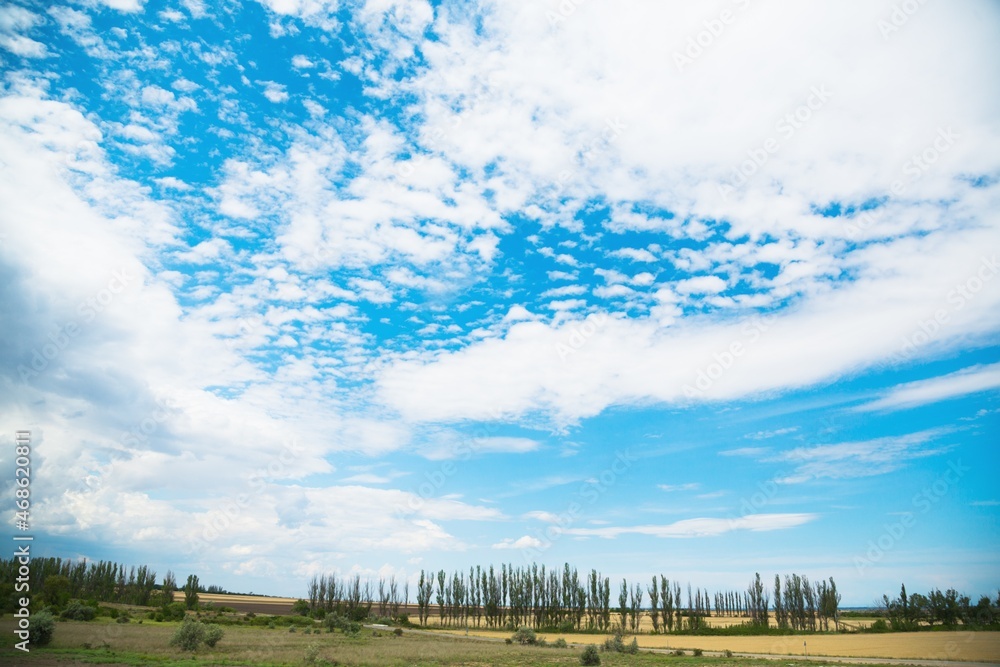 Beautiful hilly landscape in the foreground with blue sky