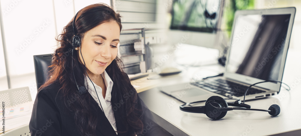 Business people wearing headset working in office to support remote customer or colleague. Call cent