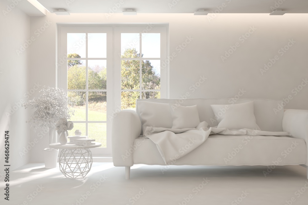 Stylish room in white color with sofa and autumn landscape in window. Scandinavian interior design. 