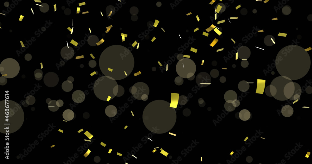 Image of light spots and confetti on black background