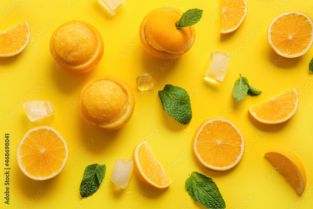 Tasty ice creams in orange peels on color background