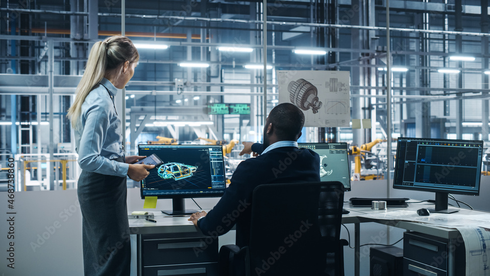 Car Factory: Female Supervisor Talks with Male Automotive Engineer, Using Computer to Design Advance