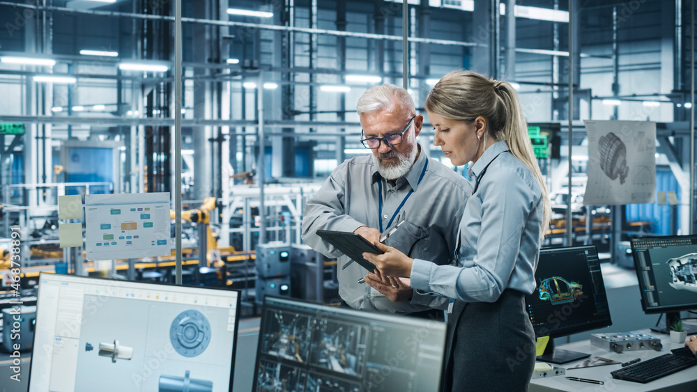 Car Factory Office: Manager Talks with Senior Engineer, Use Tablet Computer to Design Production Con