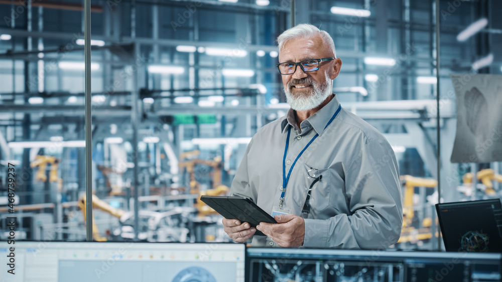 Car Factory Office: Portrait of Senior White Male Chief Engineer Using Tablet Computer in Automated 