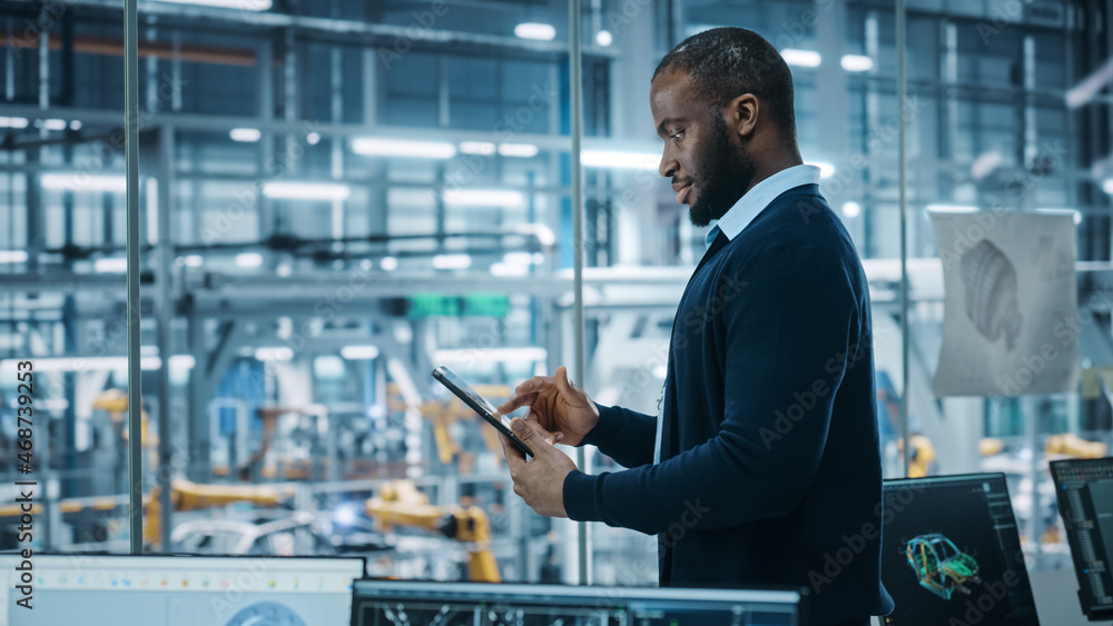 Car Factory Office: Portrait of Successful Black Male Chief Engineer Using Tablet Computer in Automa