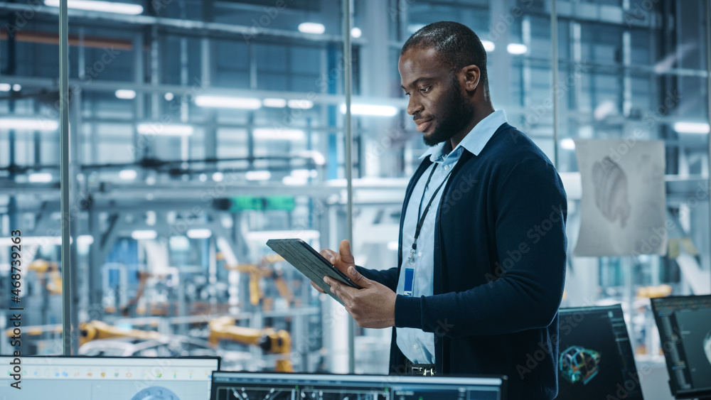 Car Factory Office: Portrait of Successful Black Male Chief Engineer Using Tablet Computer in Automa