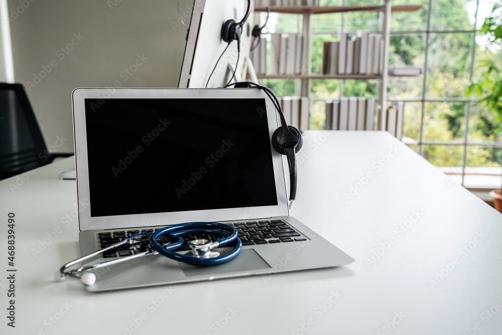 Headset and doctor equipment at clinic ready for actively support for patient by online video call .