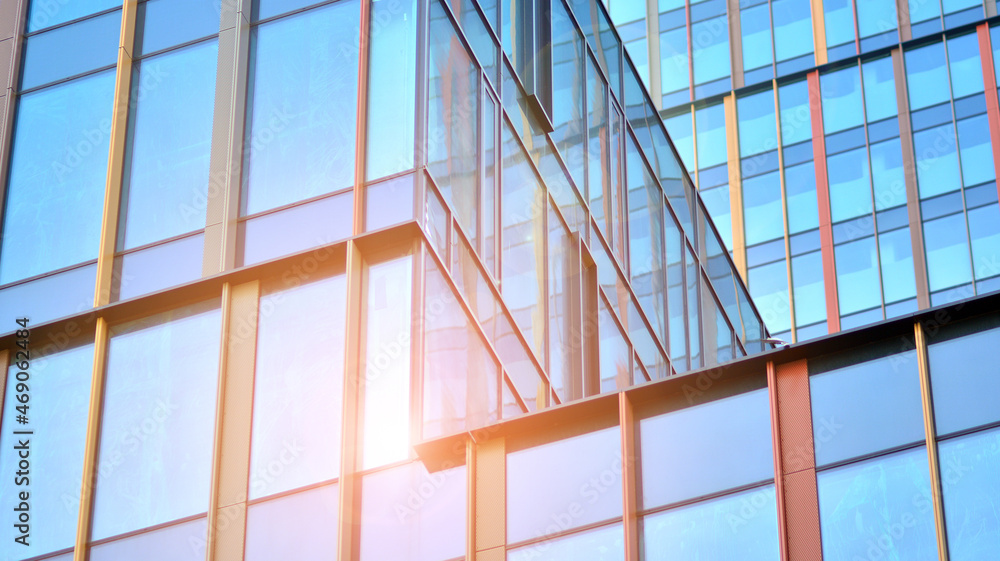  Fragment of glass and metal facade walls. Commercial office buildings. Abstract modern business arc