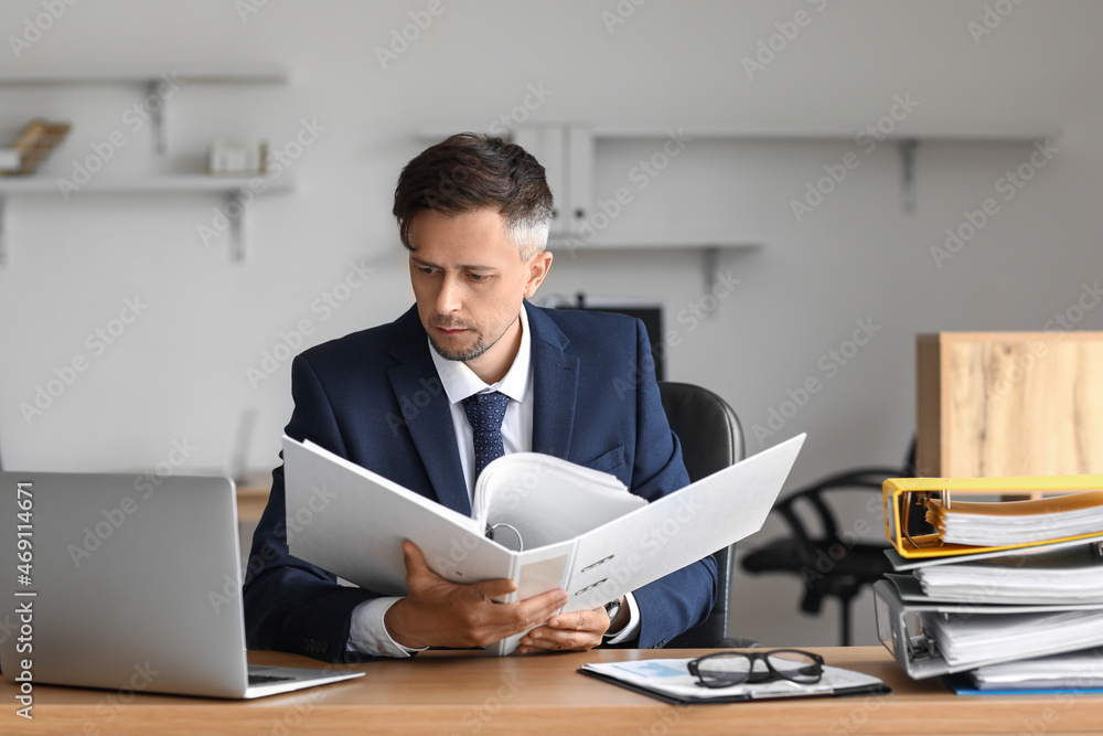 Businessman working with documents in office