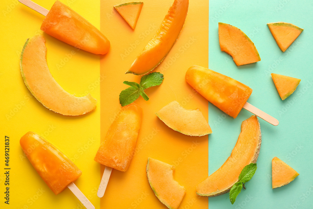 Tasty melon popsicles on color background