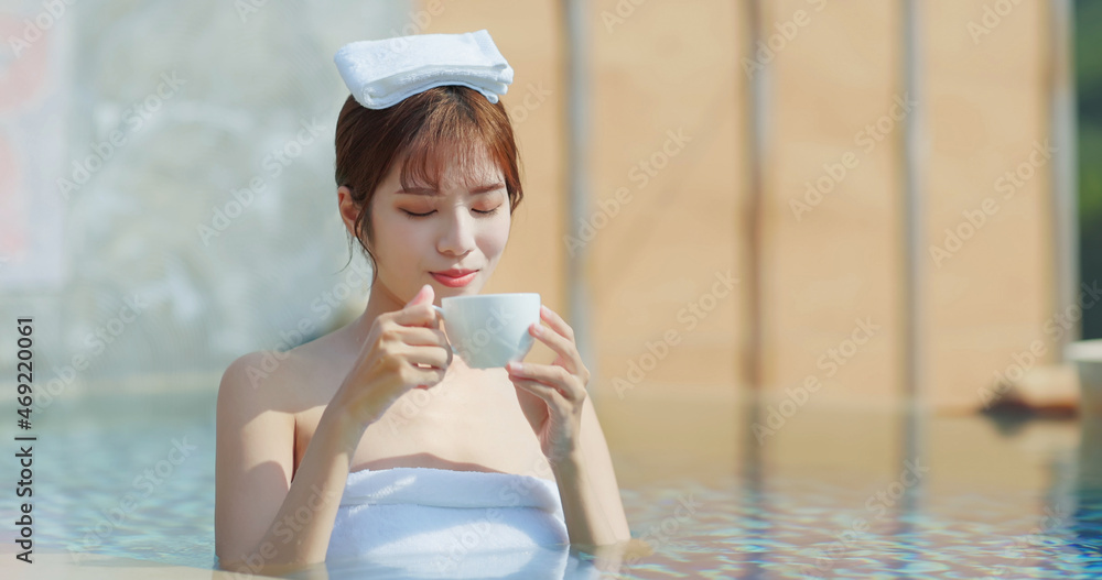 woman drink coffee in water