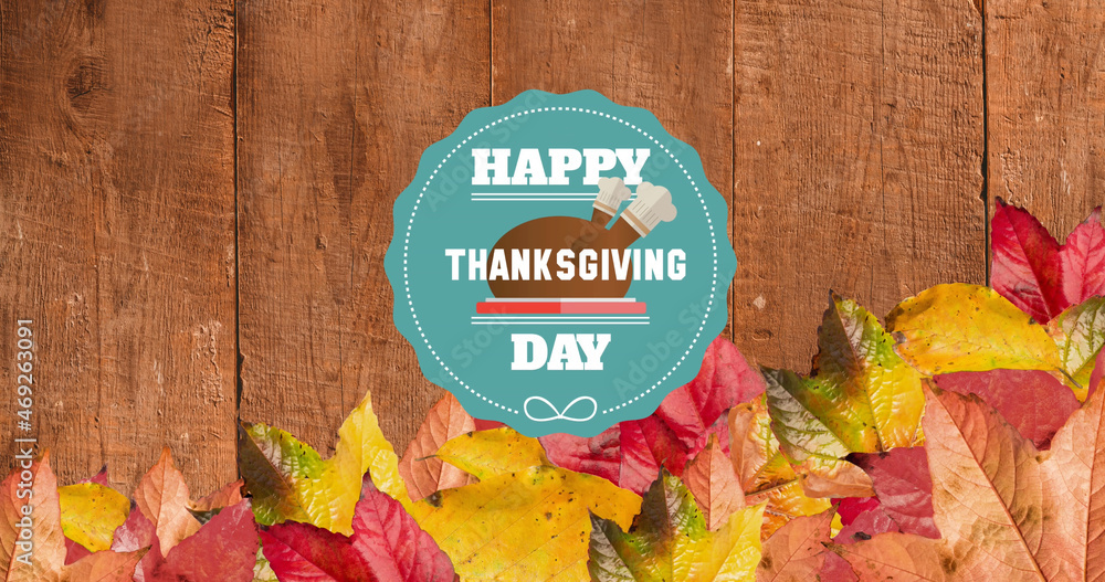 Image of happy thanksgiving day text over wooden background with autumn leaves