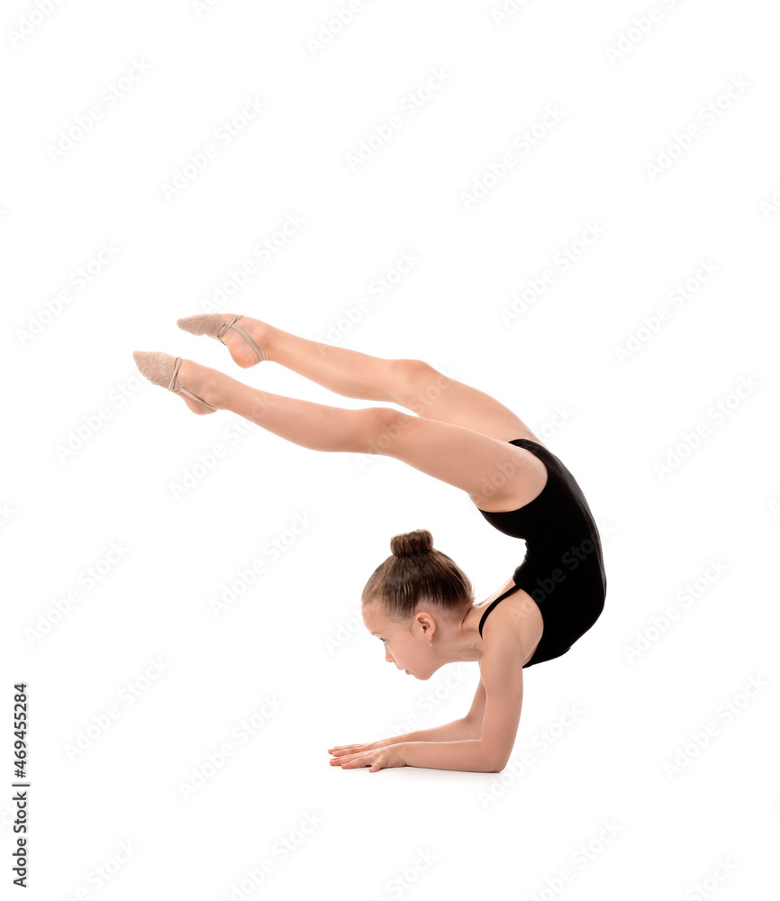 Little girl doing gymnastics on white background