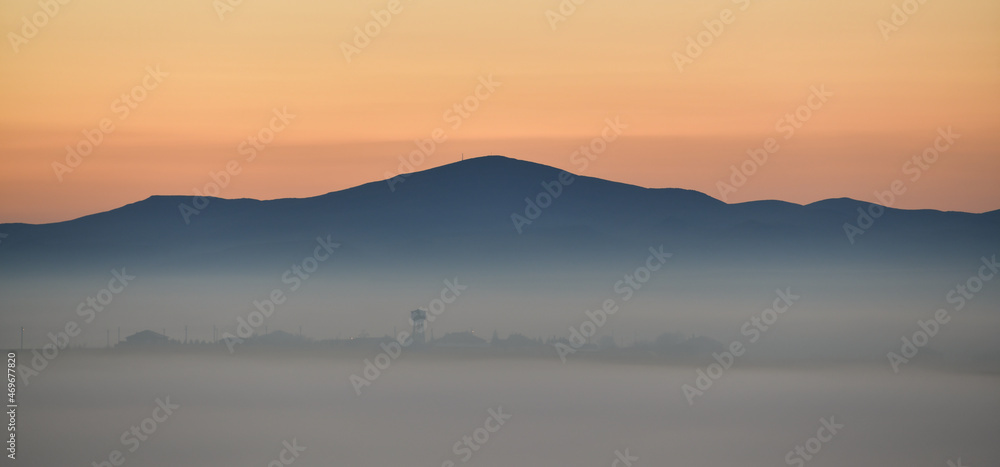 Foggy Sunset Landscape
