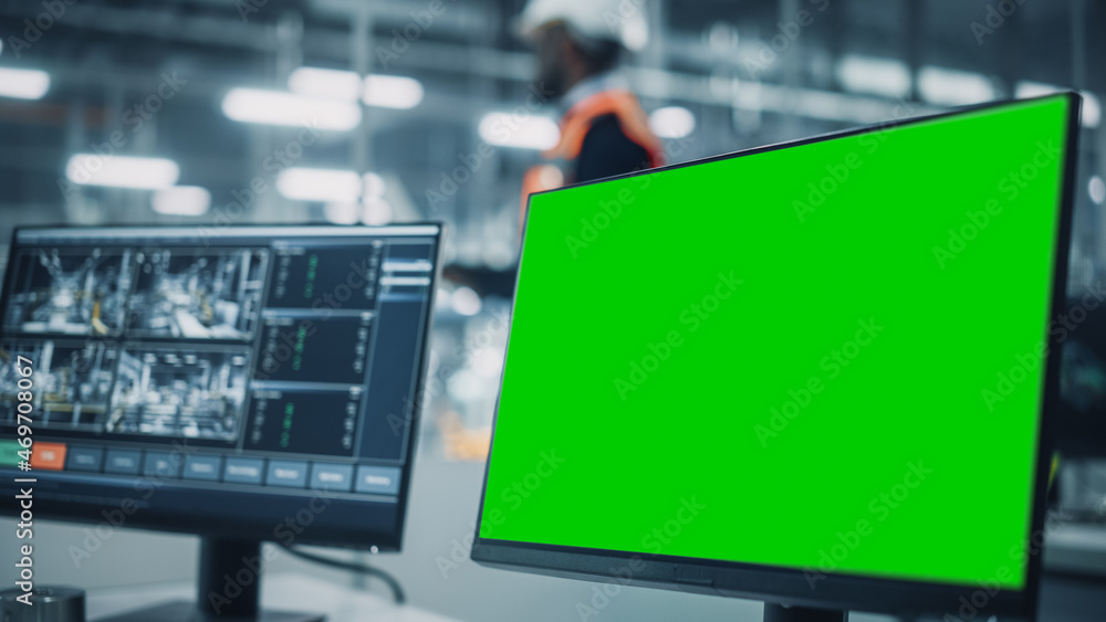 Vehicle Factory Line Operator Working at Desk with Computer with Green Screen Template Display Great