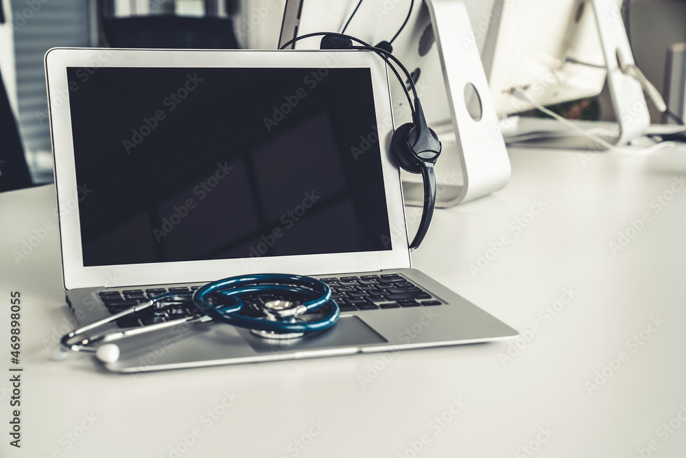 Headset and doctor equipment at clinic ready for actively support for patient by online video call .