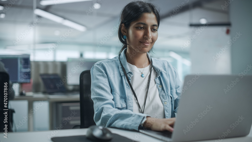 Diverse Office: Portrait of Beautiful Smiling Indian IT Programmer Working on Desktop Computer. Fema