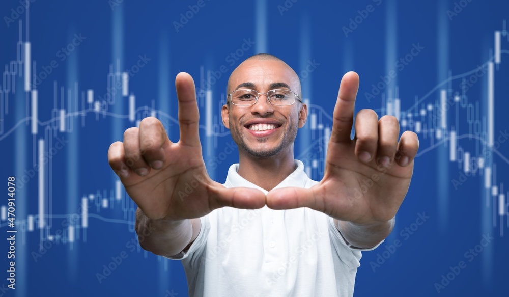 Young caucasian man, guy over dark blue background with the trading graph in graphic concept.