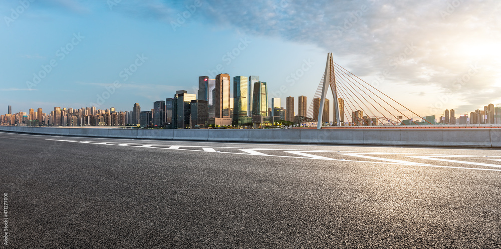 Panoramic skyline and modern commercial office buildings with empty road. Asphalt road and cityscape