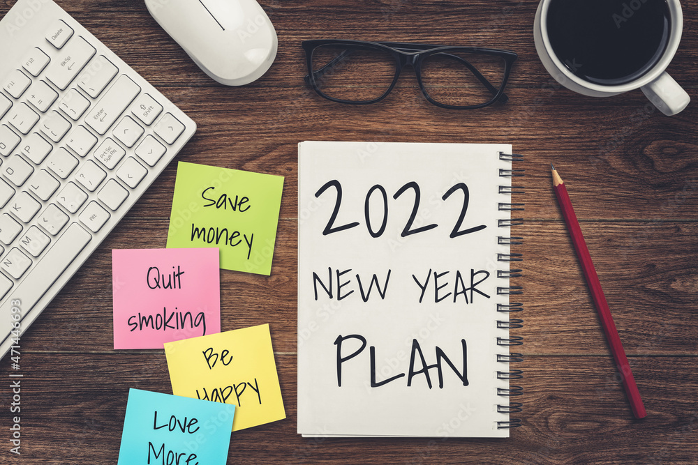 2022 Happy New Year Resolution Goal List and Plans Setting - Business office desk with notebook writ