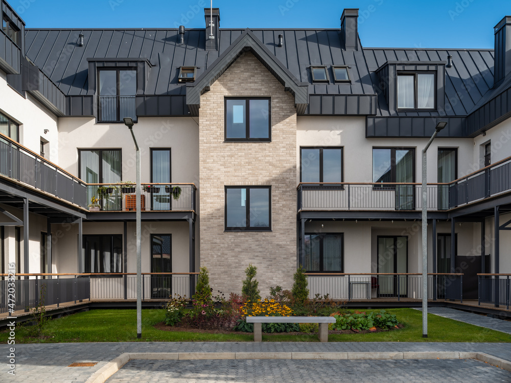 Yard of luxury residential townhouse. Modern architecture.