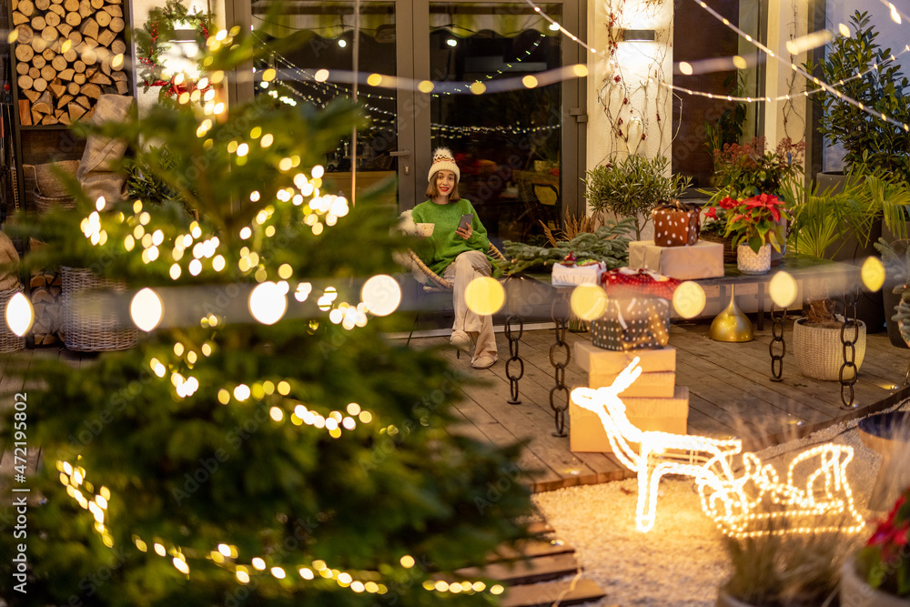 New Years decorated backyard and woman alone