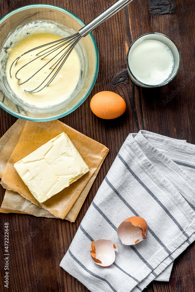 cooking pancake on wooden background top view ingredients for making