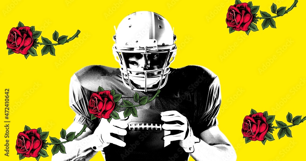 Portrait of confident male american footballer holding ball by roses against yellow background