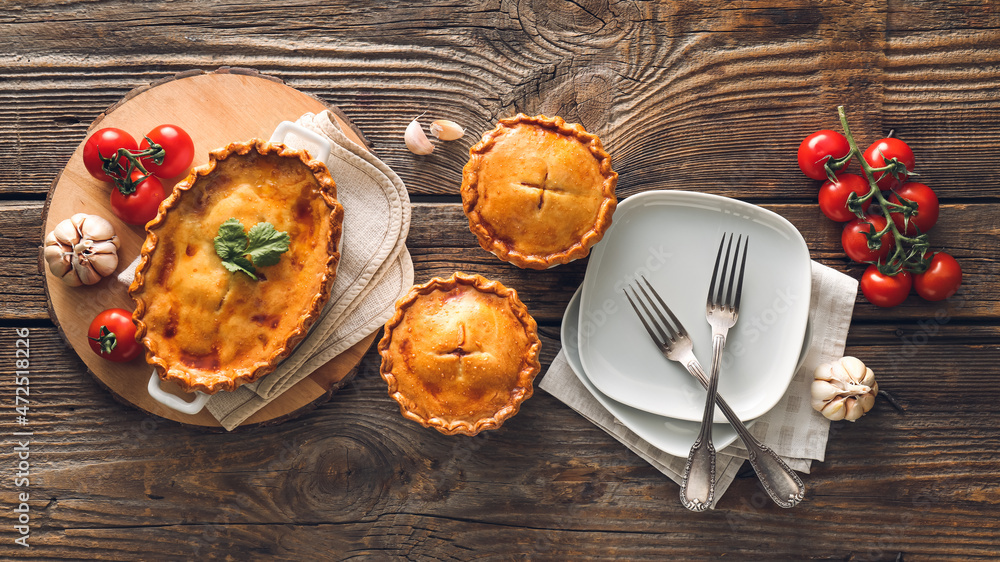 Tasty beef pot pies on table