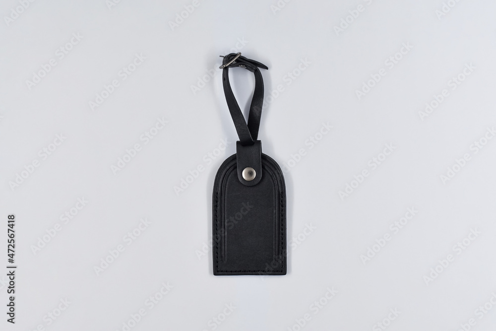 Black bag tag on white paper background