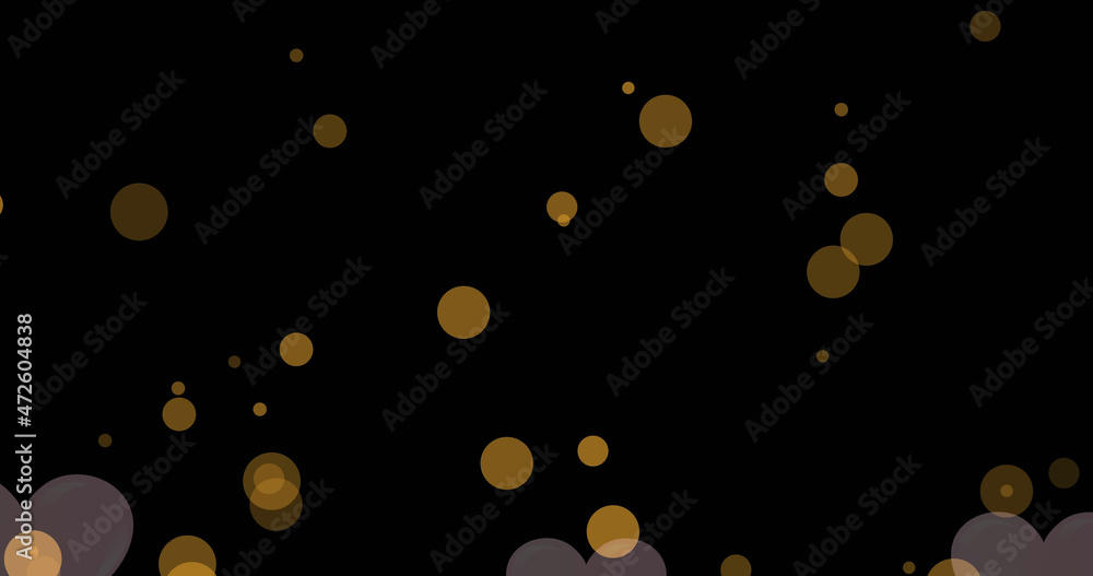 Image of pink heart floating with gold spots over black background