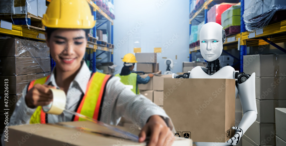 Innovative industry robot working in warehouse together with human worker . Concept of artificial in