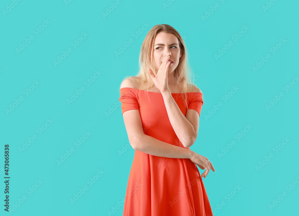 Young gossiping woman on color background