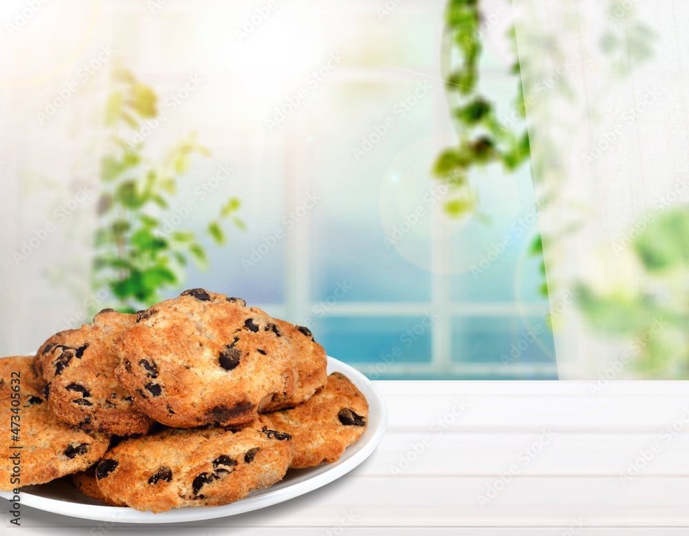 Heap of tasty sweet chip cookies on a table. Sweet breakfast.