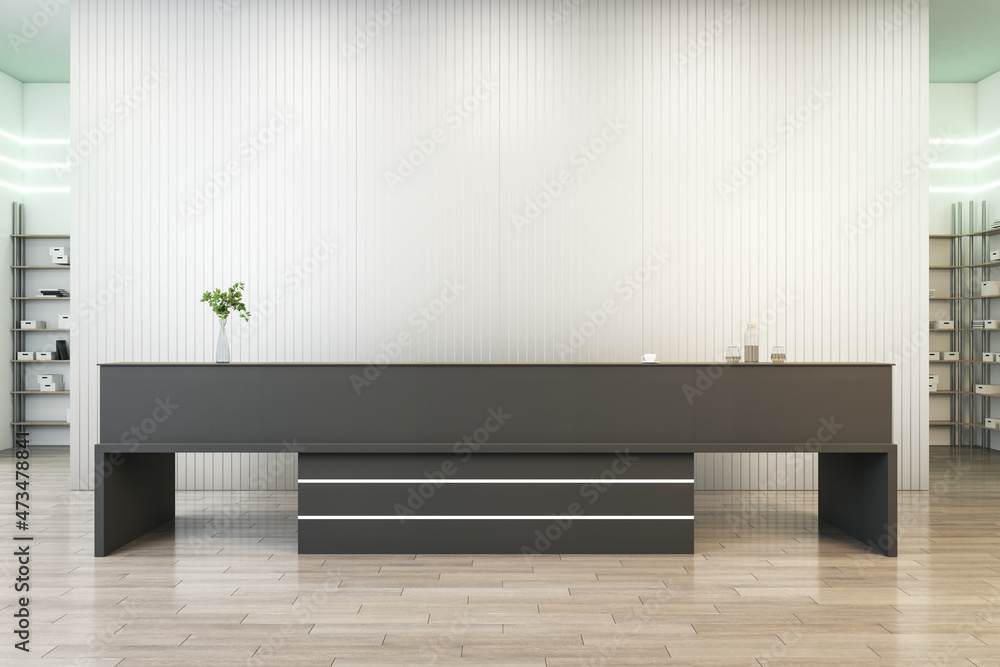 Modern concrete office interior with wooden flooring, black reception desk and mock up place on wall