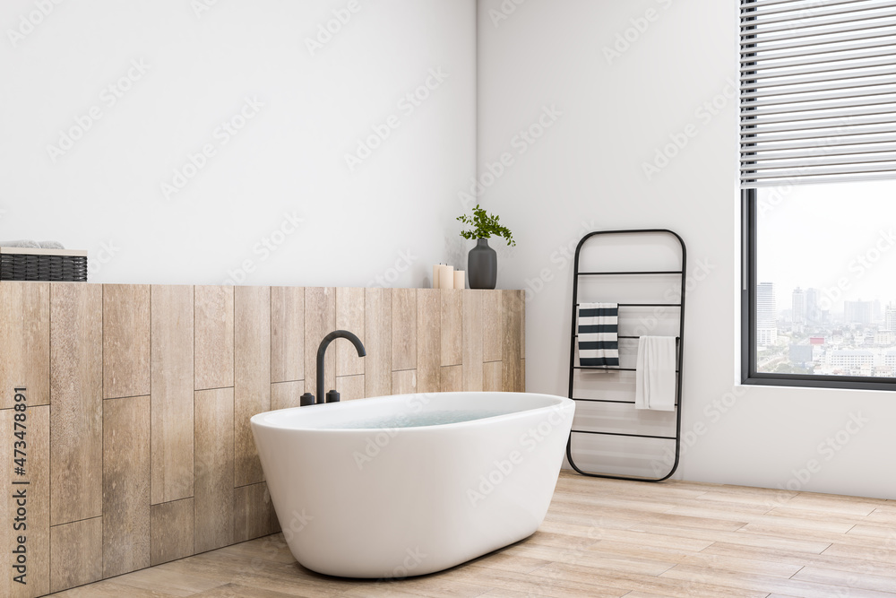 Concrete and wooden luxury bathroom interior with bright window and city view, various objects. Hote