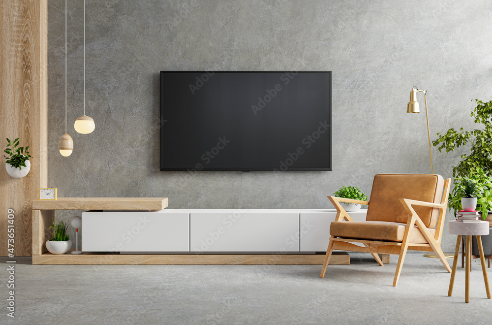 Cabinet TV in modern living room with armchair,lamp,table,flower and plant on concrete wall backgrou