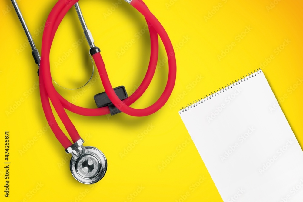 Medical concept. A card with stethoscope on the desk