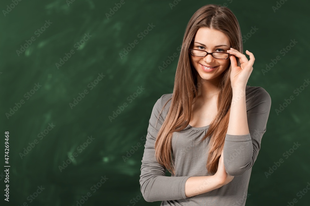 Young teacher woman teaching standing video conference with student.