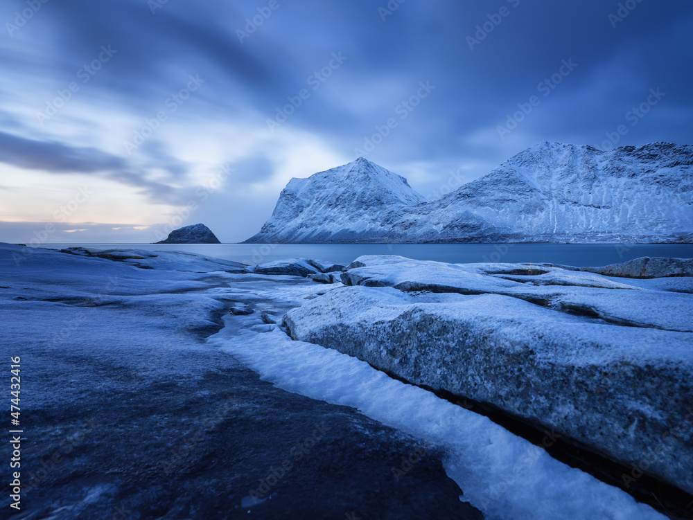 Haukland beach, Lofoten islands, Norway. Landscape with long exposure shot. Mountains, beach and clo