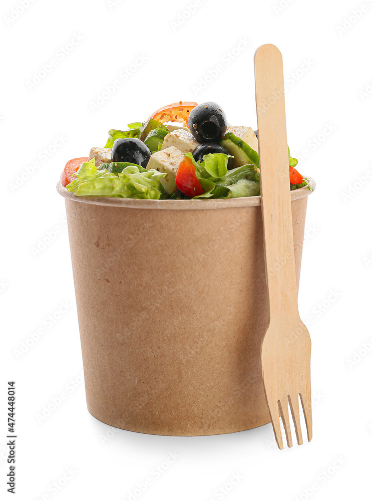 Paper box with healthy Greek salad on white background