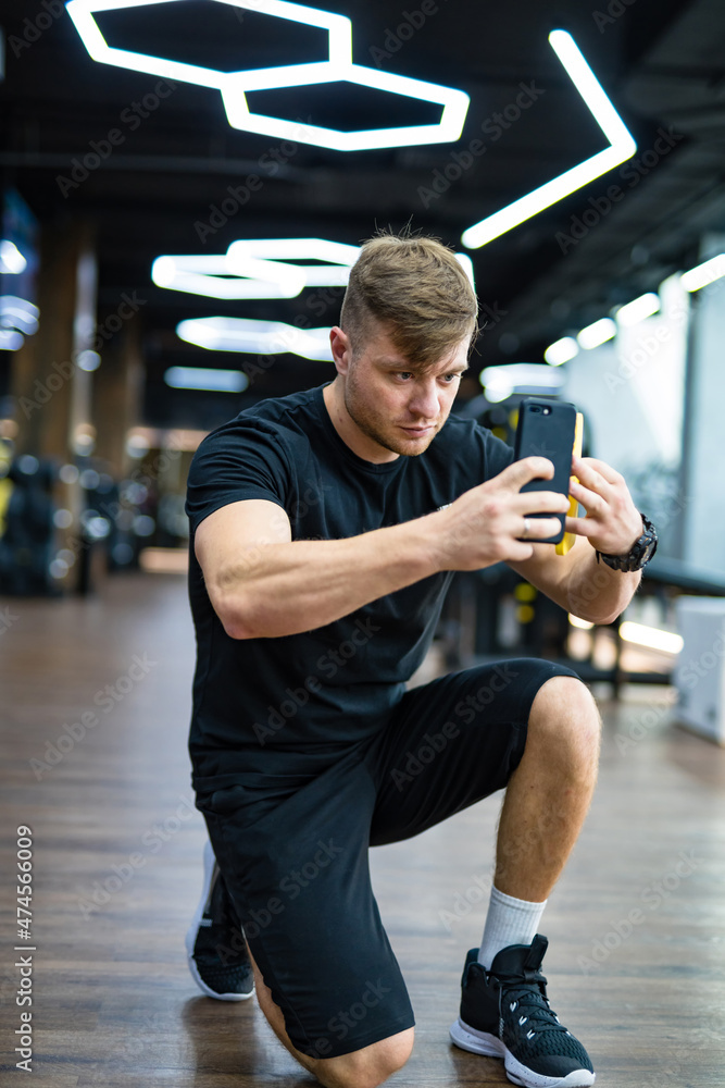 Handsome man in casual cloth taking photo. Young lifestyle man making photos with phone.