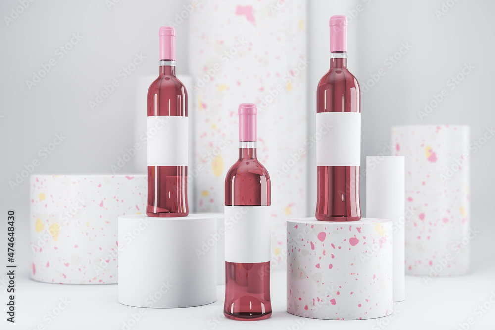 Pink rose wine bottle with empty mock up label on white backdrop. Advertisement and branding, liqor 