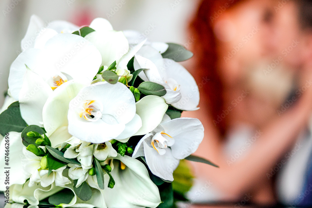 Groom and bride together with flowers