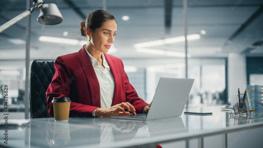 Successful Caucasian Businesswoman in Perfectly Stylish Suit Working on Laptop Computer on Top Floor