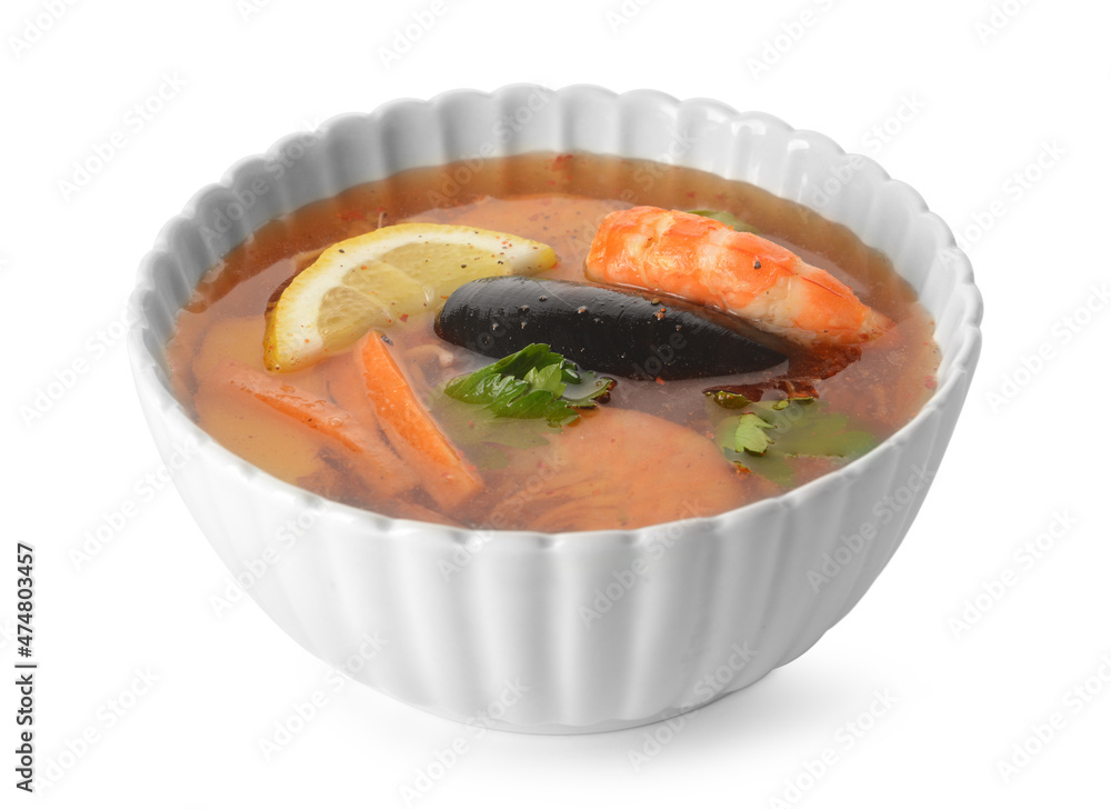 Bowl of spicy Thai soup on white background