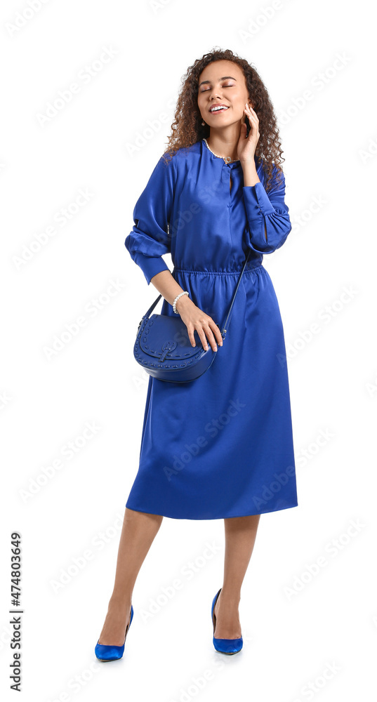 Fashionable African-American woman on white background